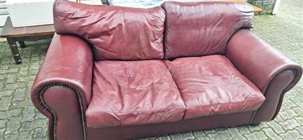 2x Geniune leather two seater couches with coffee table