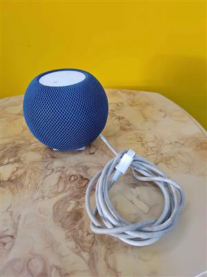Apple HomePod mini smart speaker in blue.