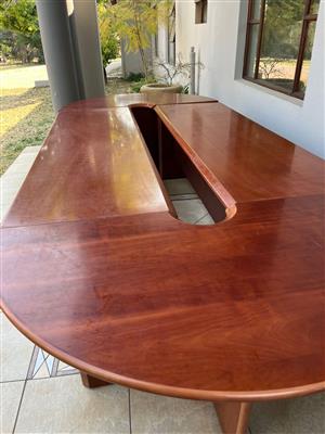 Cherry wood modular board room table with 6 chairs .