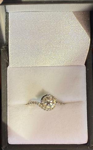 White gold diamond ring with smaller diamonds on band