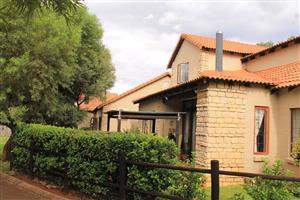 This beautifully positioned corner, freestanding townhouse in Olive Tree Cove.
