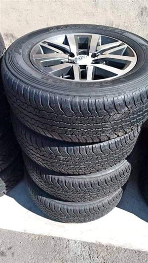 18" Toyota Hilux Fortuner mags with nice used 265/60/18 Dunlop grandtrek AT set 