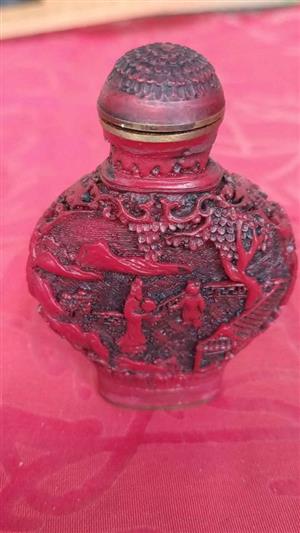 antique Chinese carved cinnabar snuff bottle.