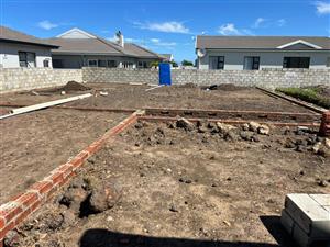 The open-plan kitchen, lounge, and dining area creates a spacious living environment.