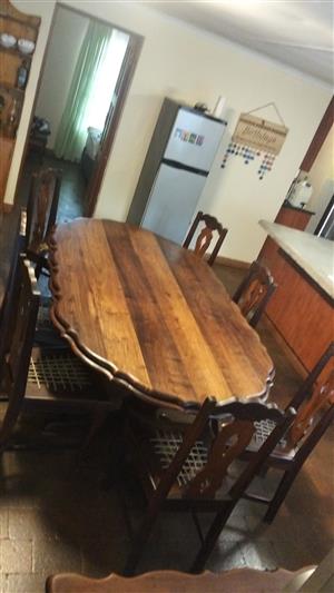 Solid ambulance dining room table, 8 chairs and buffet