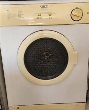 Two used Defy Tumble Dryers