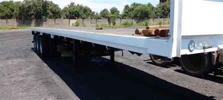 Flatdeck triaxle  in a good condition for sale