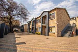 Private rooms in shared 3-bedroom units, communal braai areas, secure parking