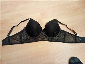 Bra black underwired balconette 36D  intricate floral lace detailing small center bow with a rhinest