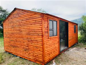 Log home with sliding glass door and windows