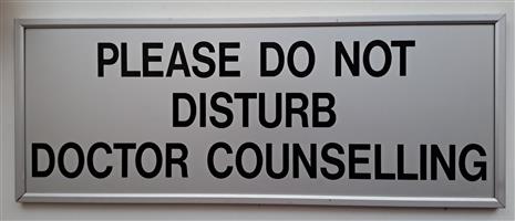 Alluminium Sign: "Please do not disturb doctor counselling". 