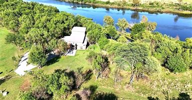Escape to riverfront living in the beautiful Koelwater Estate!