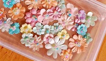 Beautiful handmade craft flowers in soft pastel colours.