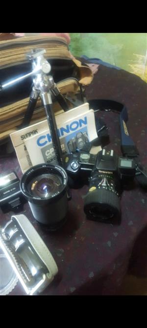 Cp 7m chinon slr camera with multiple accessories. 