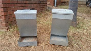 Two silver colored dog feeders, both for the advertised price 