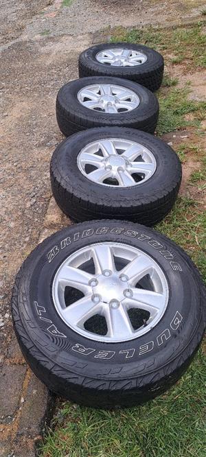   A set of 16inch mag s and tyres 245/70/16"