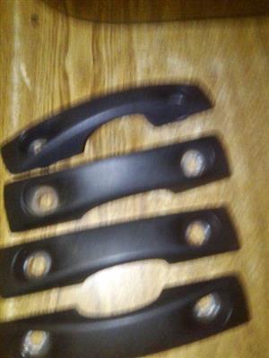 Side holders for tie downs 