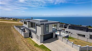 Modern Luxury Meets Endless Horizons: A 4-Bedroom Coastal Masterpiece with 180 Panoramic Sea Views