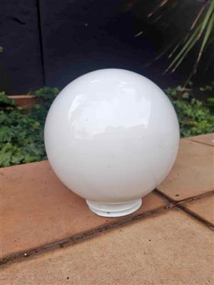 Milk glass globe lamp shade with screw-in base.