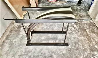 Modern glass top table with metal base