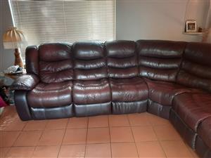 L shaped synthetic leather.very nice with 2 recliners on both end,good condition