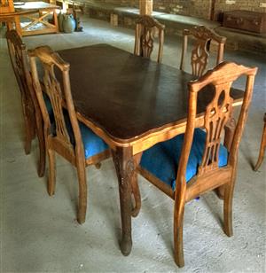 Antique carved dining table and chairs