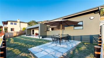 Step into this modern, light-filled Knysna Heights home and feel instantly at ease.