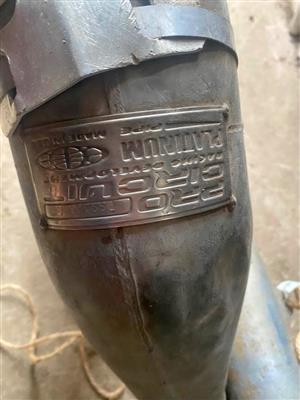 Suzuki RM 250 pro circuit exhaust. Meyerton bike scrapyard new and secondhand spares and accessories