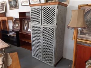 Large, pine cupboard with lattice doors