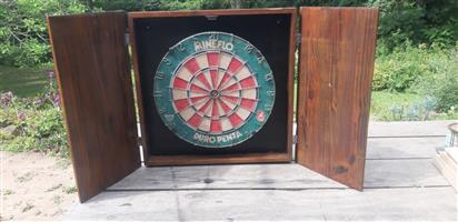 Dart board with wooden case and darts 
