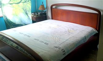 King sized extra length cherry wood bed + free mattress.