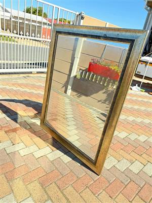 Large Goldish framed mirror with pattern