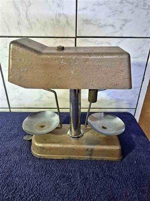 vintage Omal Universal Money Checker, also known as a coinage weighing scale.