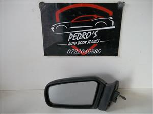 Mazda 323 '98 left mirror (Manual)