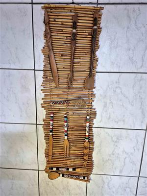 A set of decorative, handcrafted wooden cutlery and utensils