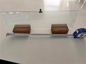 Glass picture frame with wooden stand. Size 17.5 height and 50 width . Good condition