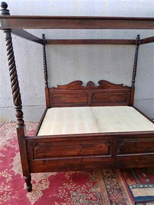 "Antique Dark Wood Four-Poster King Size Bed with Carved Headboard