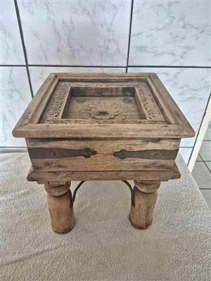 Antique, hand-carved wooden side table, likely made of teak