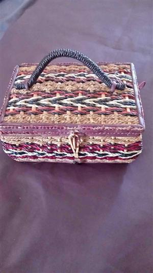 woven wicker design, commonly referred to as a retro sewing basket or wicker storage box.