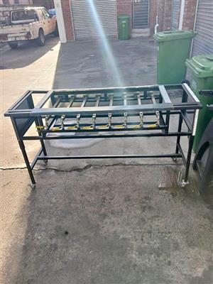 8 burner flame Griller With removable legs and sauce racks for 1/4 inserts.