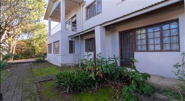 Large home with 3 flatlets, lots of potential.