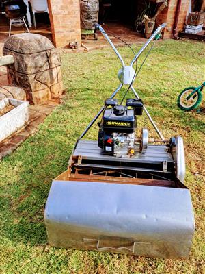 25" Professional lawn mower, new 6.5 hp motor as well as new handles.