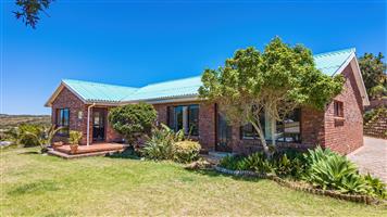 Low-maintenance facebrick home situated on a hilltop.