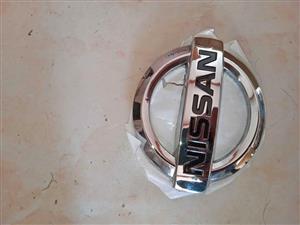 NP200 TAILGATE BADGE