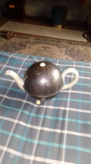 German teapot in plated container