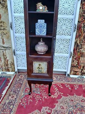 Vintage Dark Wood Display Cabinet with Eclectic Décor