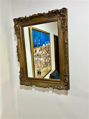 Ornate gold framed mirror