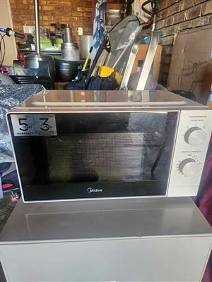 Combo small Bauer fridge and Midea Microwave for sale.