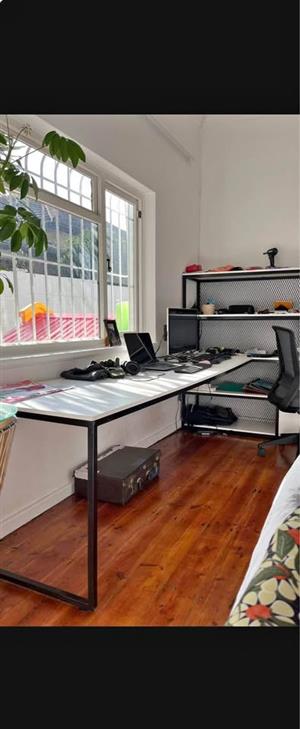 Custom built desk with white melamine top & black steel desk frame with shelving unit with 3 drawers