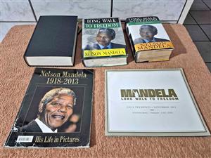Collection of books and a program related to Nelson Mandela